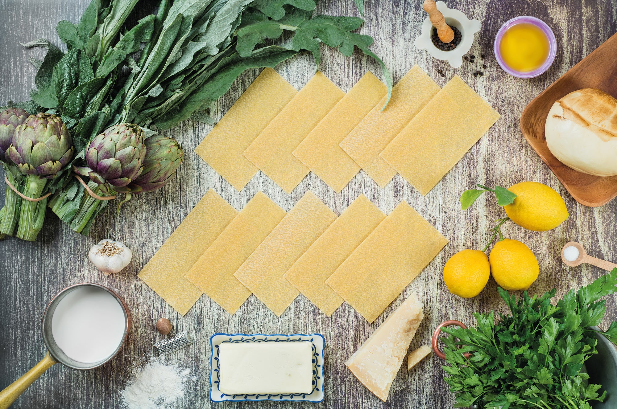 Lasagne con besciamella, provola, parmigiano e carciofi